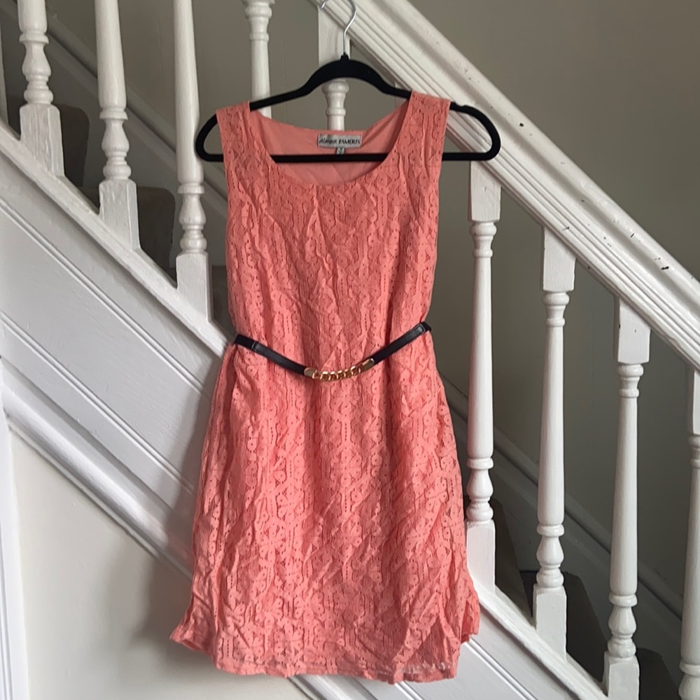 Pink mid-thigh loose fitting dress.